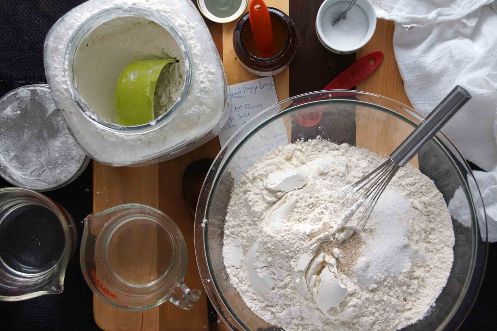 Whisking together dry ingredients for pizza dough